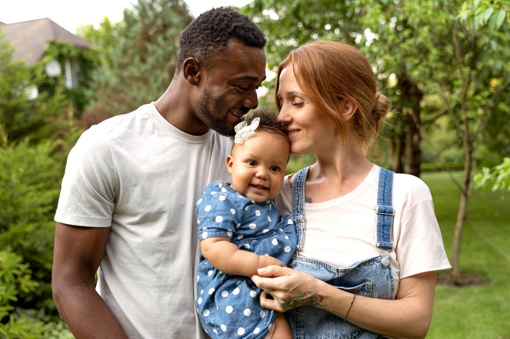 Diverse family with baby outdoors