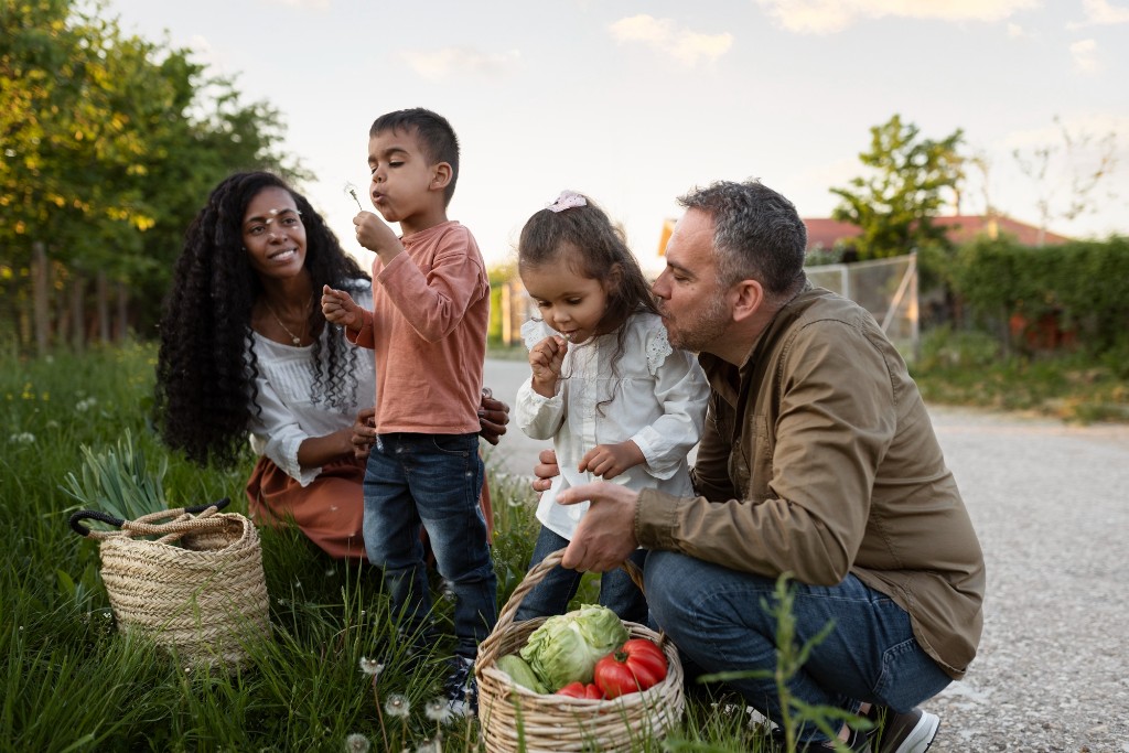 Diverse family outdoors with children